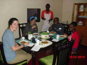 (Right to left, sitting) Joan, Muraya, Dennis Makau, Krista Simonson and Emily Egan (Vincent standing)